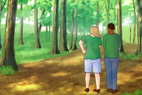 Two People Stroll in Quiet Forest