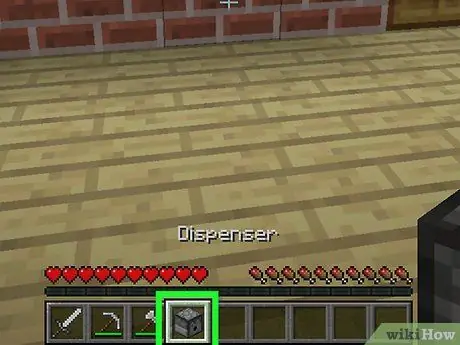 Feu un dispensador al pas 17 de Minecraft